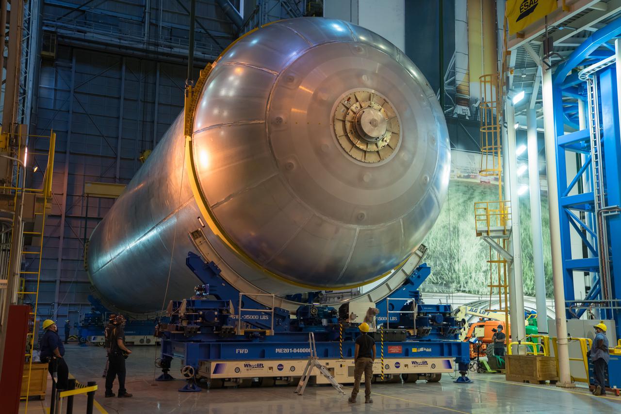 This image highlights the liquid hydrogen tank that will be used on the core stage of NASA’s Space Launch System rocket for Artemis II, the first crewed mission of NASA’s Artemis program. The tank is being built at NASA’s Michoud Assembly Facility in New Orleans. The SLS core stage is made up of five unique elements: the forward skirt, liquid oxygen tank, intertank, liquid hydrogen tank, and the engine section. The liquid hydrogen tank holds 537,000 gallons of liquid hydrogen cooled to minus 423 degrees Fahrenheit and sits between the core stage’s intertank and engine section. The liquid hydrogen hardware, along with the liquid oxygen tank, will provide propellant to the four RS-25 engines at the bottom of the cores stage to produce more than two million pounds of thrust to launch NASA’s Artemis missions to the Moon. Together with its four RS-25 engines, the rocket’s massive 212-foot-tall core stage — the largest stage NASA has ever built — and its twin solid rocket boosters will produce 8.8 million pounds of thrust to send NASA’s Orion spacecraft, astronauts and supplies beyond Earth’s orbit to the Moon and, ultimately, Mars. Offering more payload mass, volume capability and energy to speed missions through space, the SLS rocket, along with NASA’s Gateway in lunar orbit, the human landing system, and Orion spacecraft, is part of NASA’s backbone for deep space exploration and the Artemis lunar program. No other rocket can send astronauts in Orion around the Moon in a single mission.